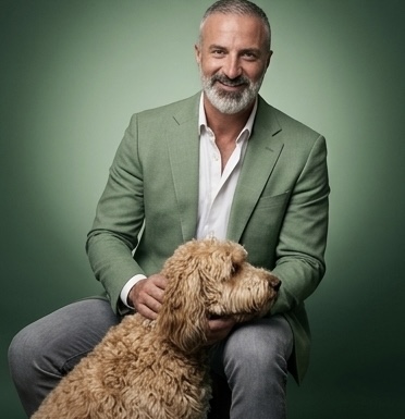 Armen, founder of Kid's Best Doodle, with one of his Goldendoodles