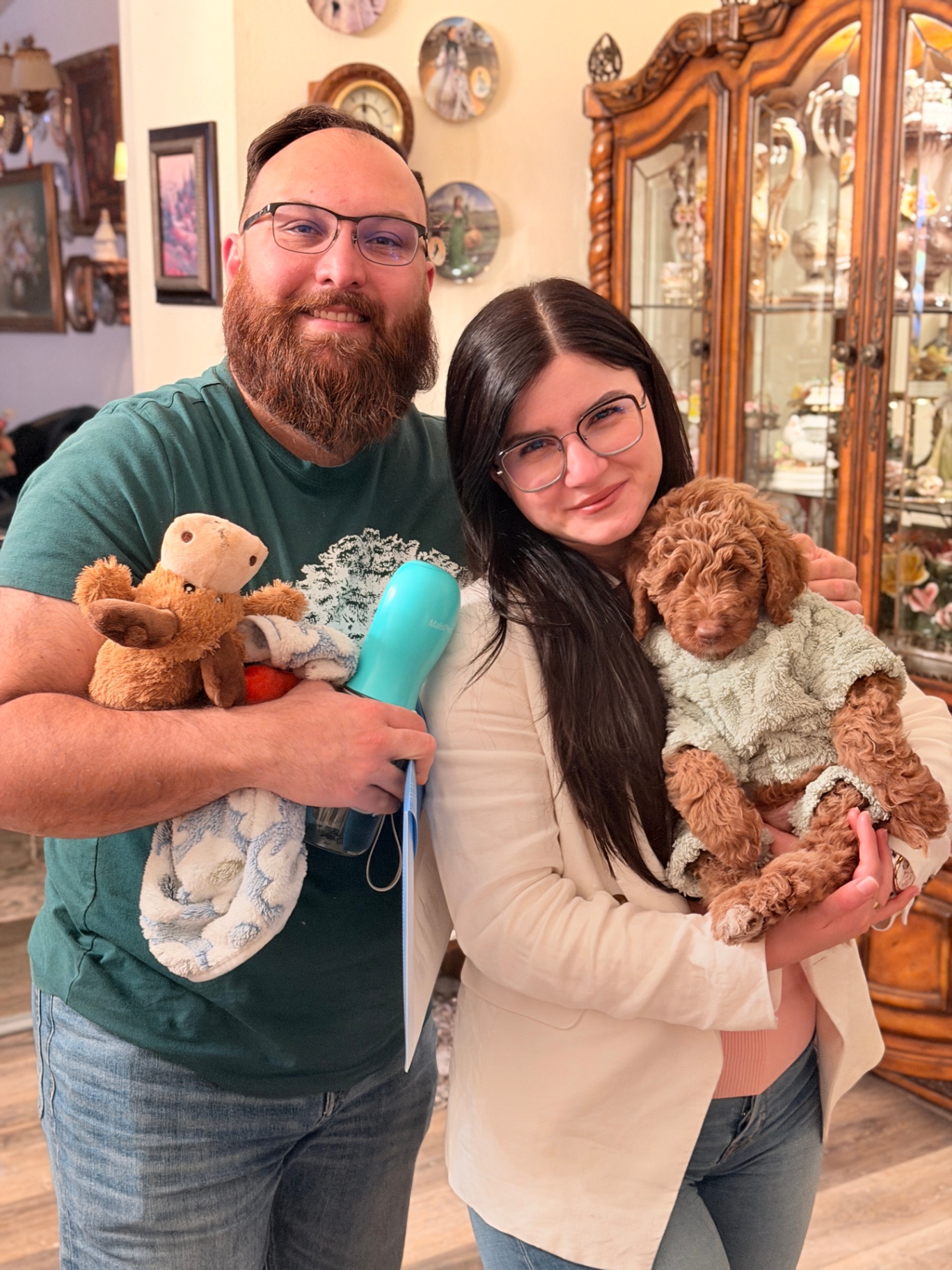 A Kid's Best Doodle family preparing for homecoming with their puppy's blanket, toy, and supplies